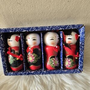 Set of Four Japanese Kokeshi Dolls in Red and Black Saving Bank
